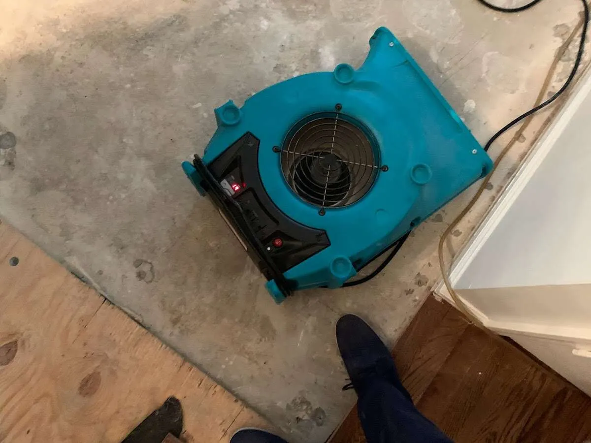 Air mover drying subfloor during Commercial Water Damage Restoration in Fort Walton Beach